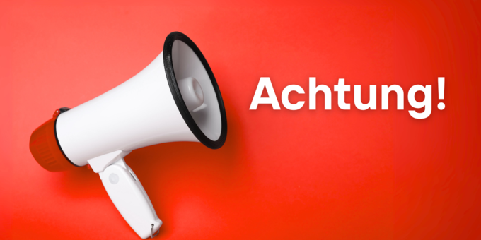Megafon mit Schriftzug "Achtung!"