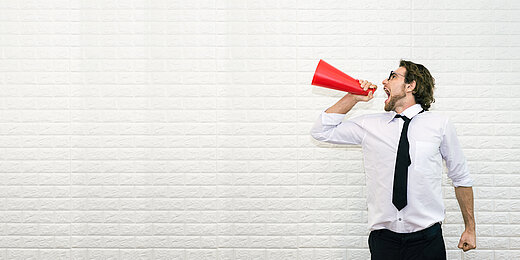 Businessman Shouting on the Megaphone to Said Something with Copy Space for Put Your Text or Wording to Make Background , Banner , Cover , Advertise